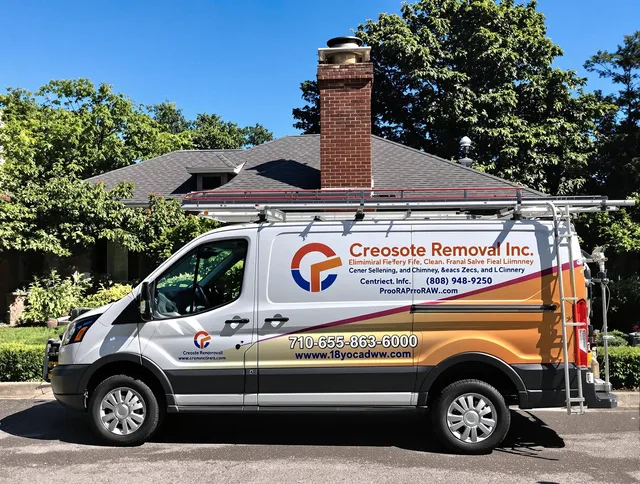 Monroe Chimney Sweep technician removing creosote safely in Monroe, NC