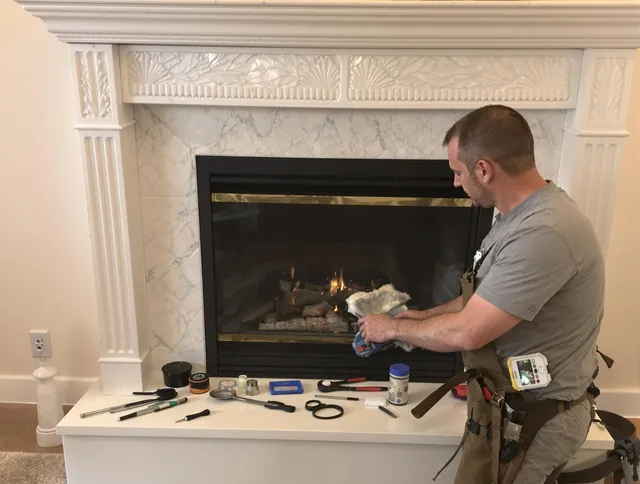 Monroe Chimney Sweep performing fireplace maintenance in Monroe, NC