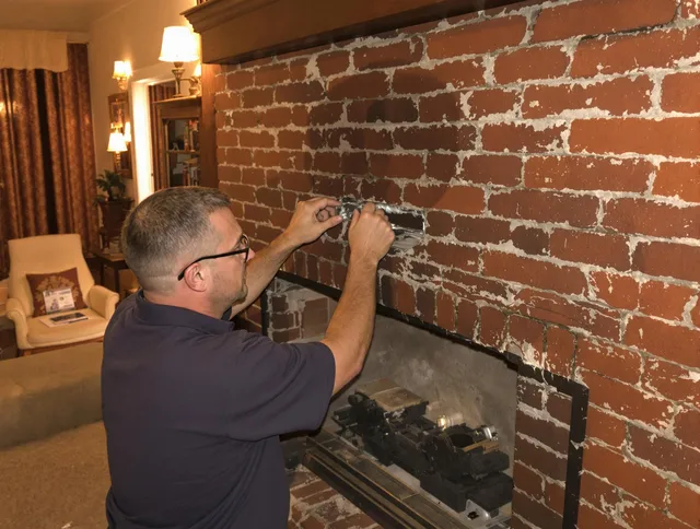 Monroe Chimney Sweep expert fixing a fireplace in Monroe, NC